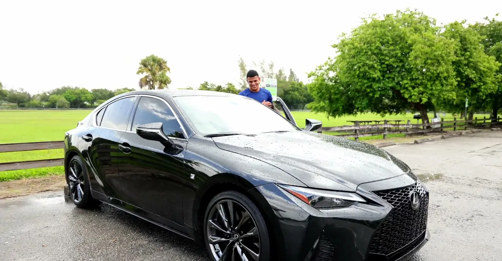 A black sedan parked in a Miami park