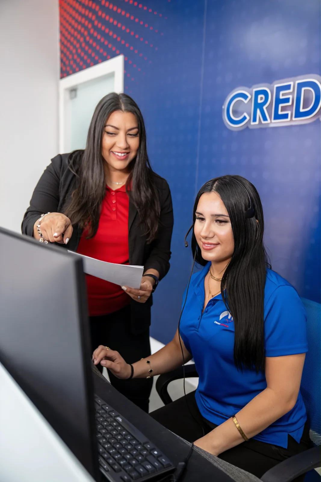 An A Plus Credit Services specialist walks a client through his credit report